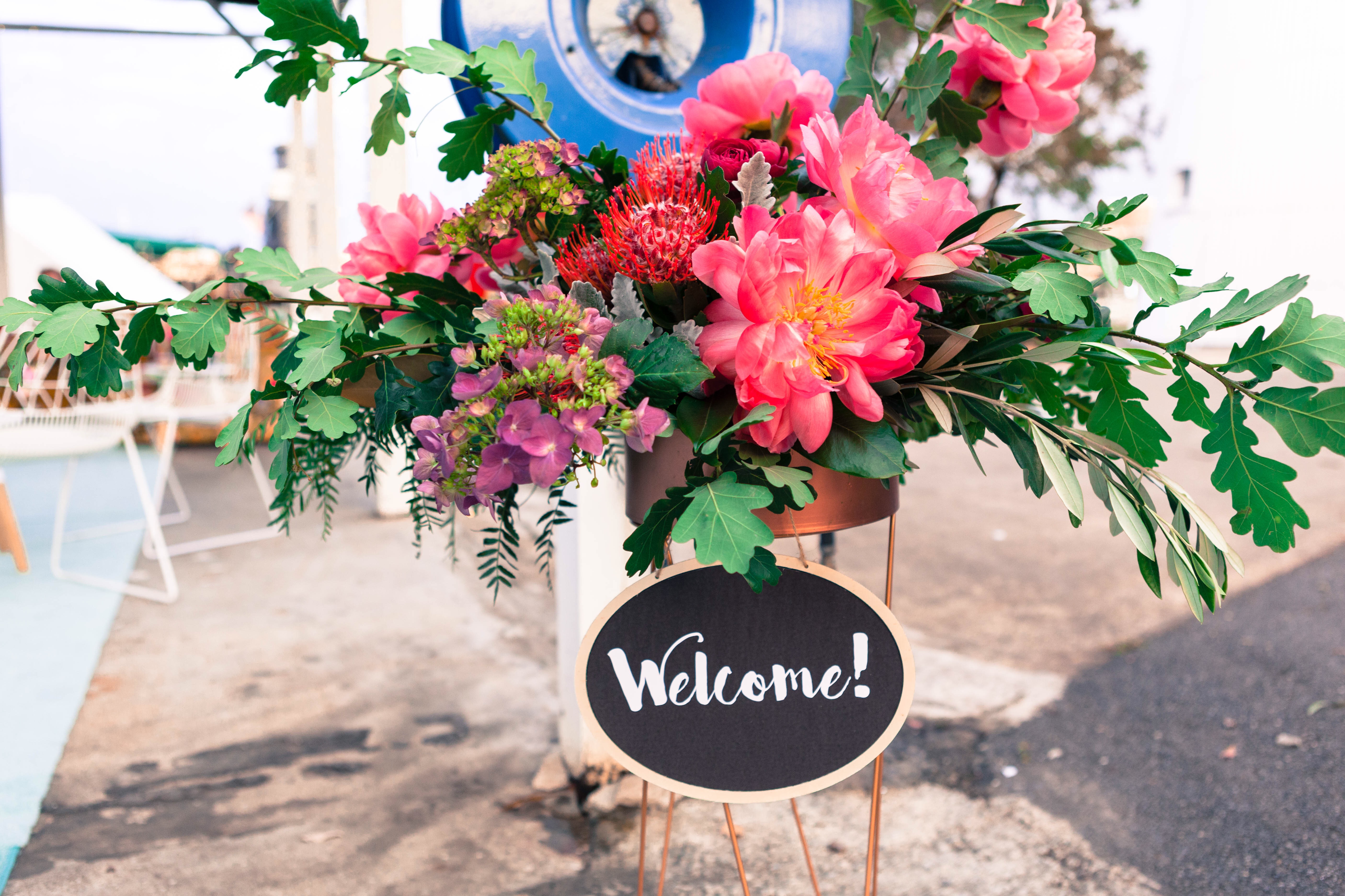 Flowers and a party welcome sign