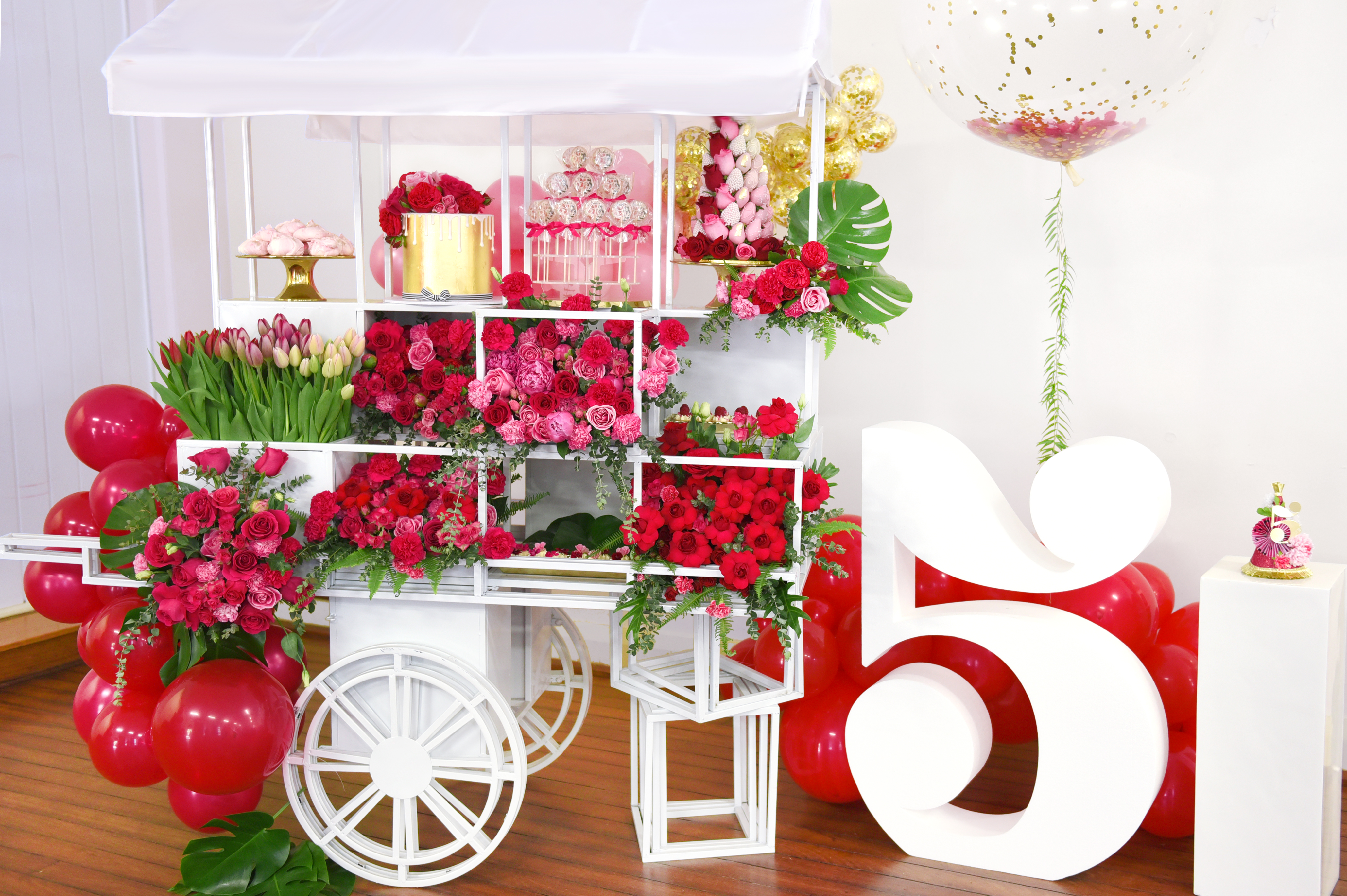Chanel cart with balloons, flowers and desserts