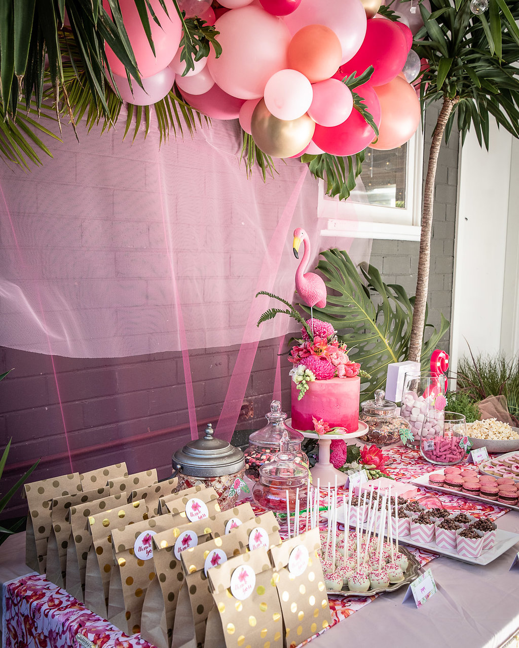 Dessert table at a flamingo themed birthday party