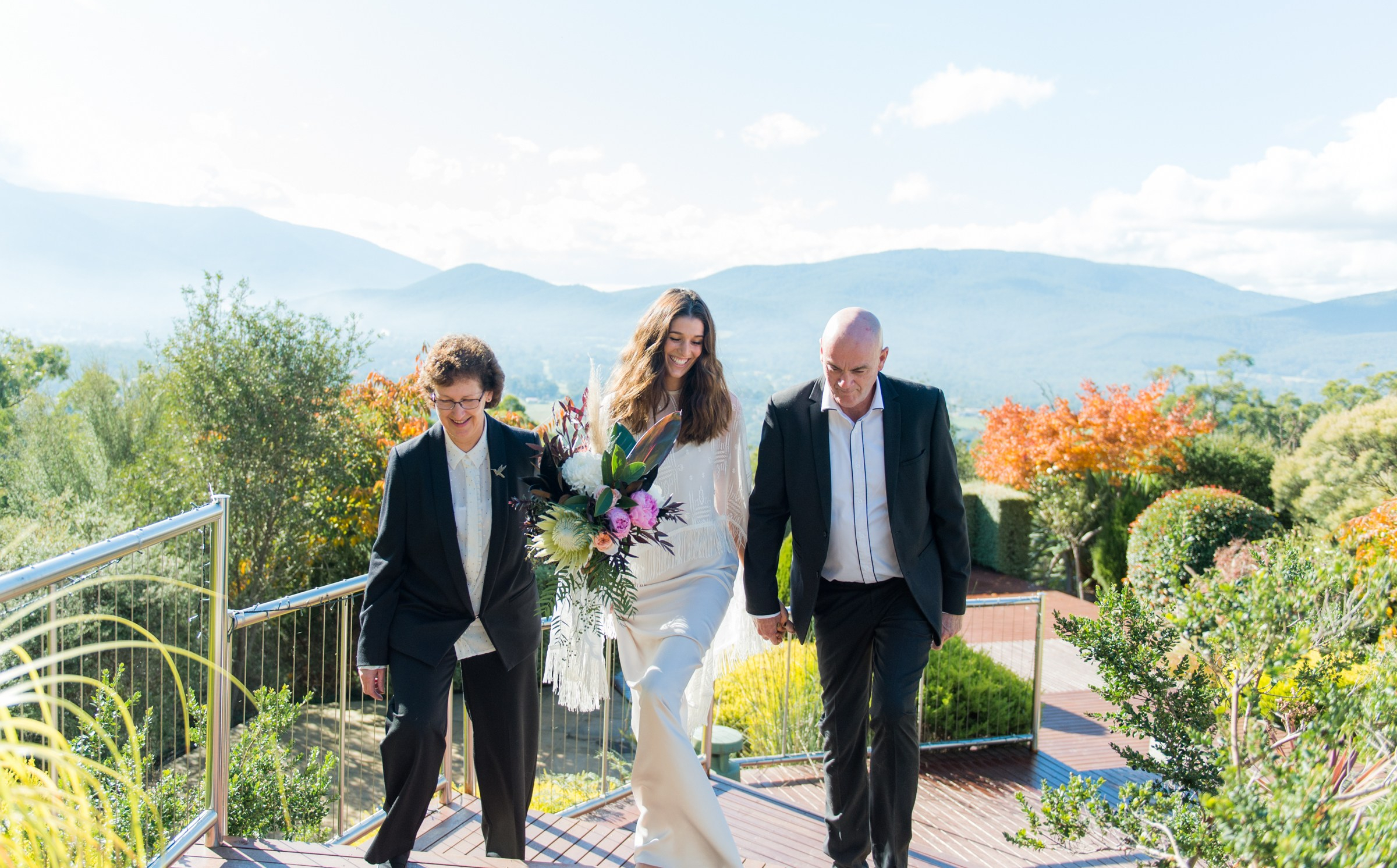 The bridge being walked up the aisle by both mum and dad.