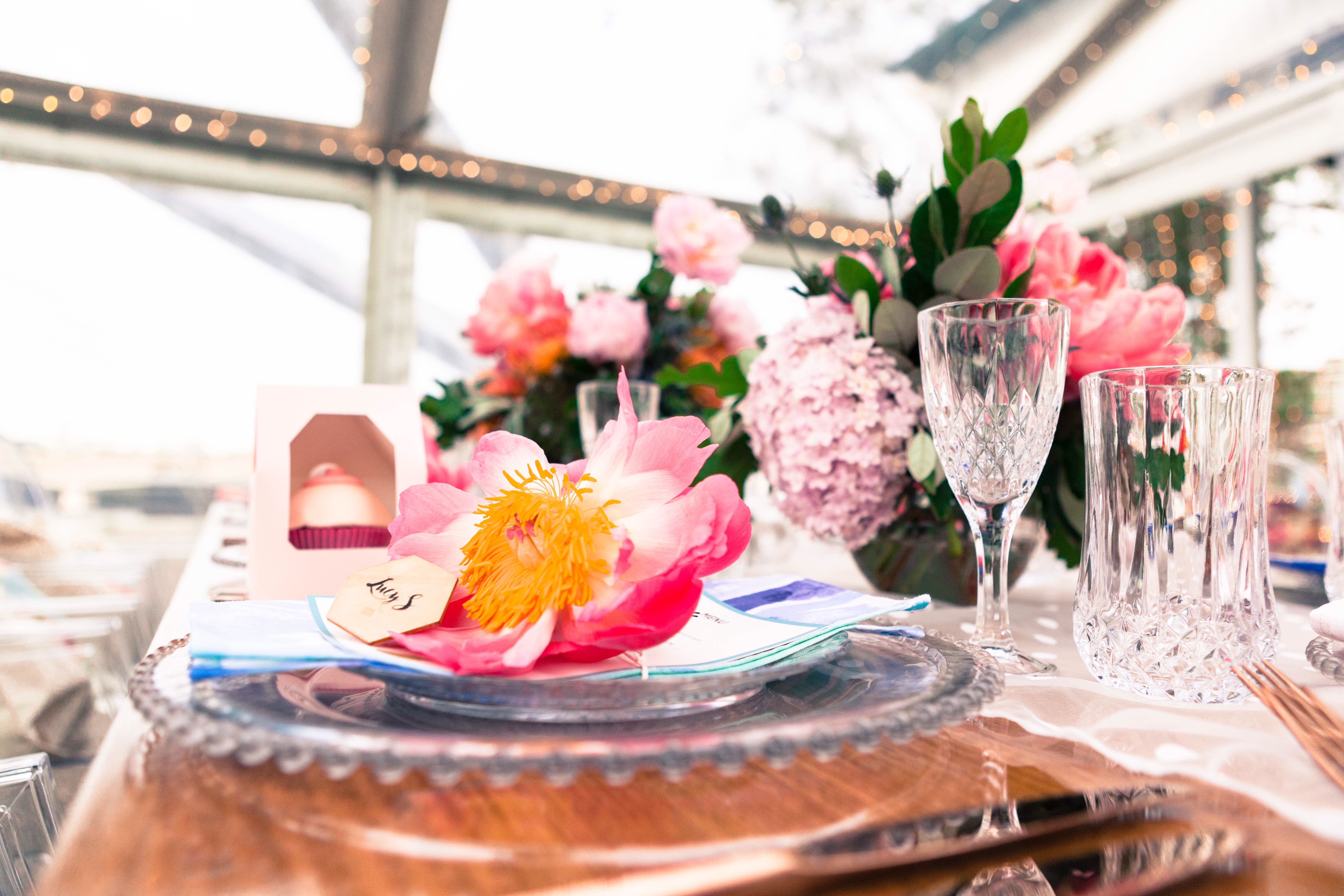 Florals adorning a table at a dinner party