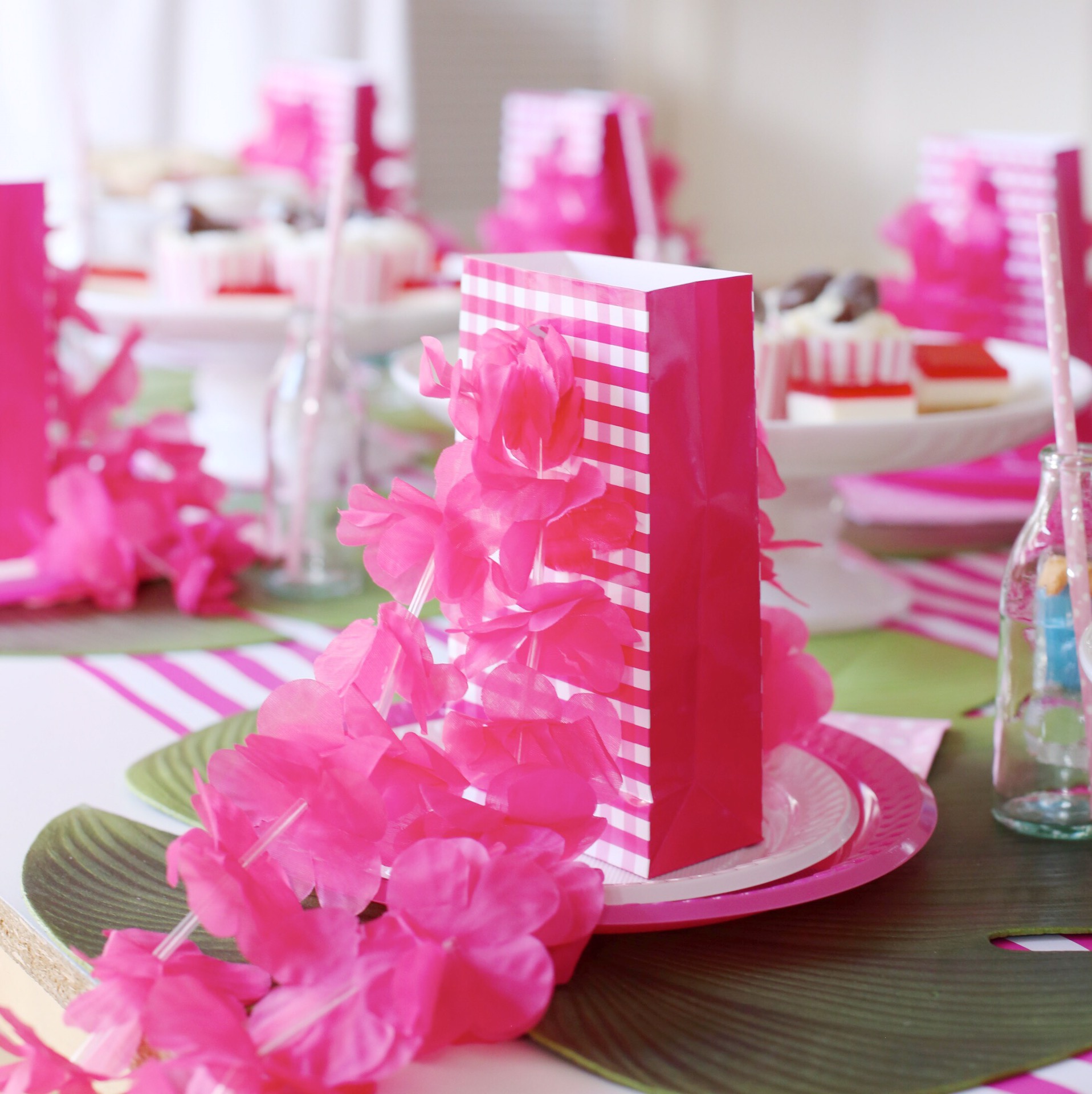 Pink party favour bags with lei