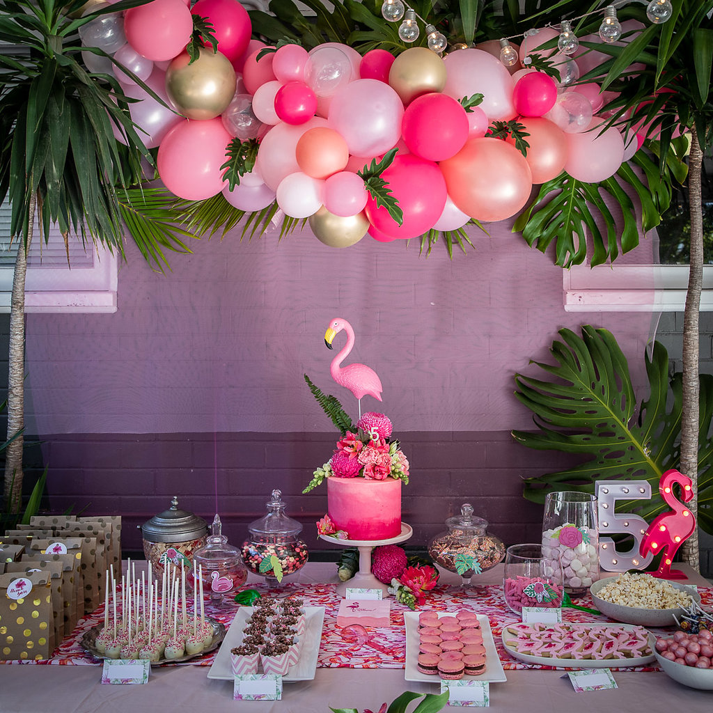Dessert table set up at a flamingo themed birthday party