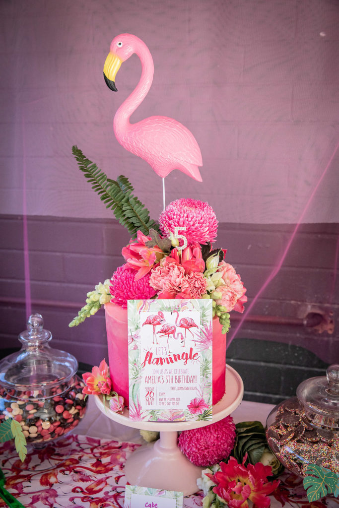 Lets flamingle invite and cake at a flamingo themed birthday party at a flamingo themed birthday party