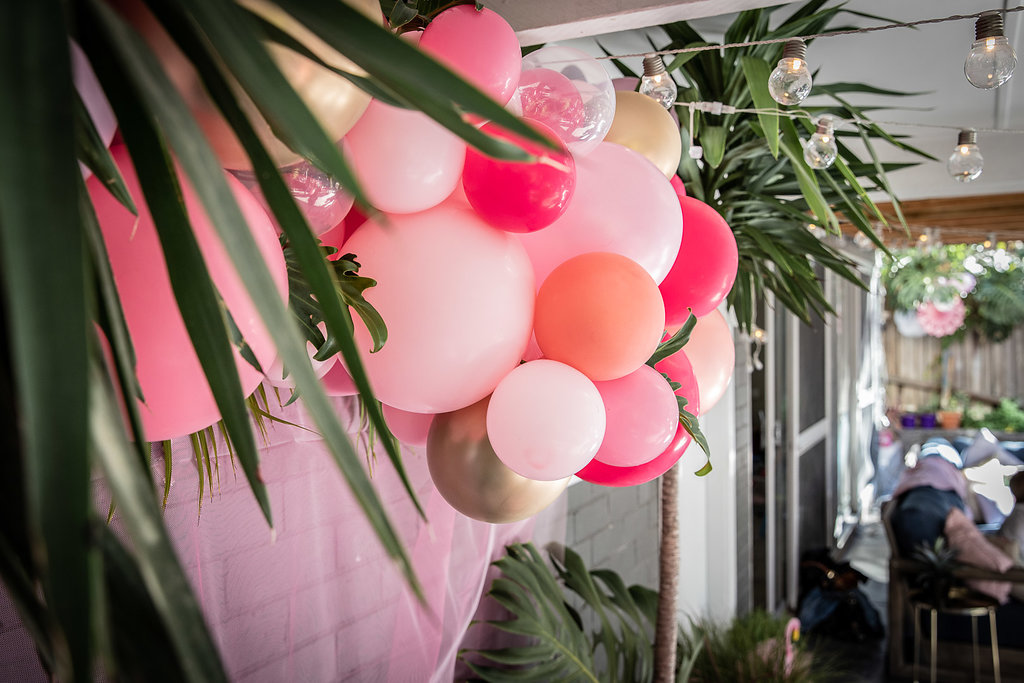 Tropical balloon garland at a flamingo themed birthday party
