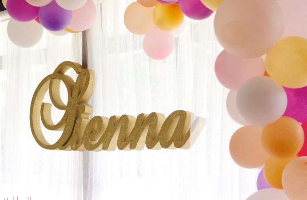 Foam name at a Pink, white and gold first birthday