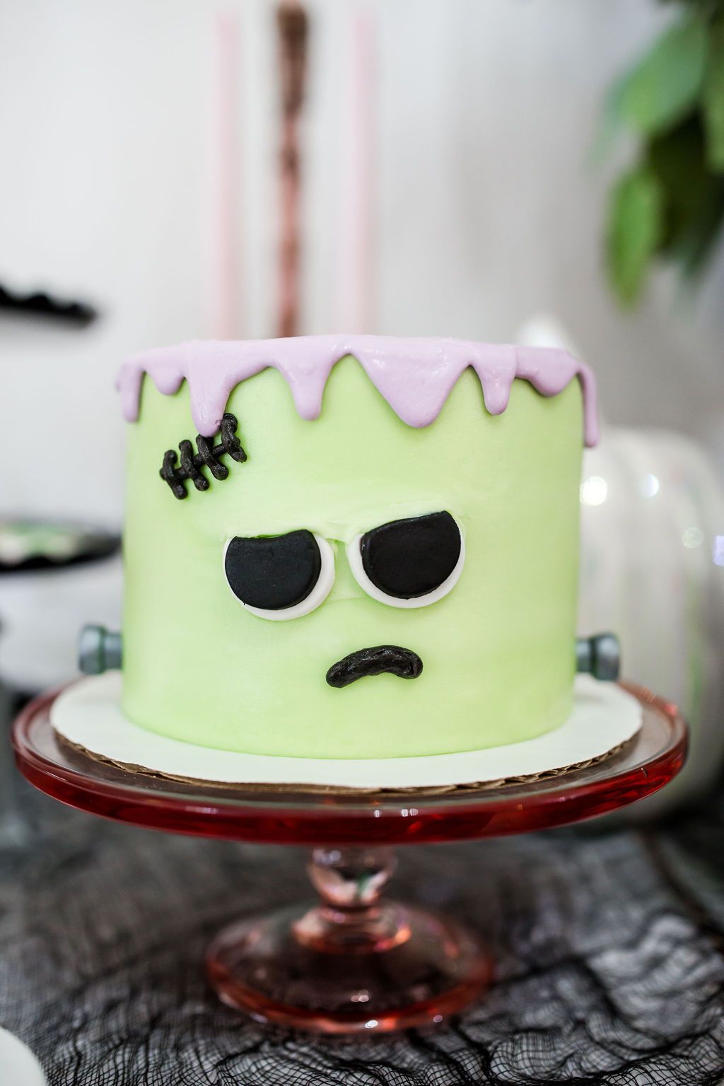 A pastel monster mash Halloween cake