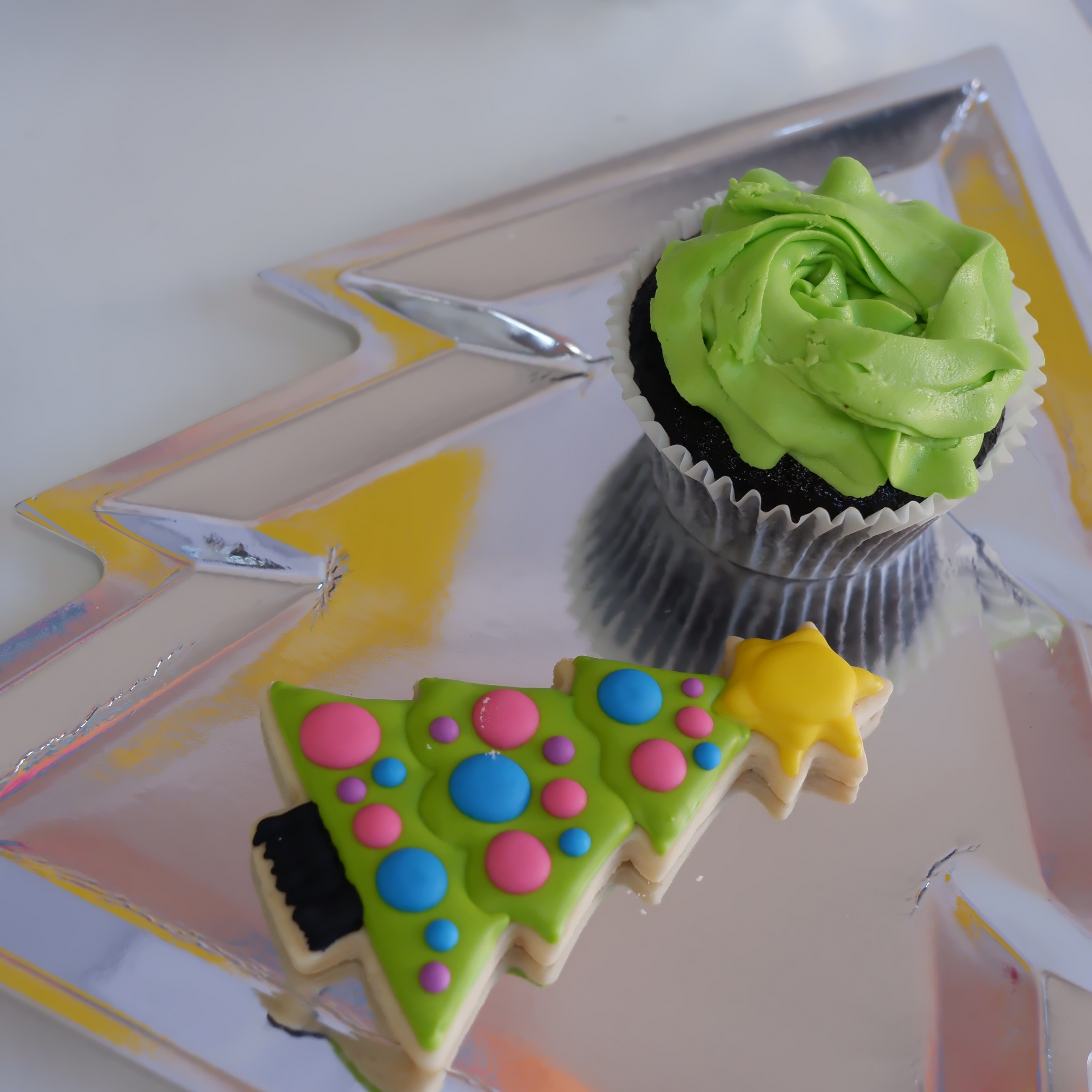 Neon green cupcake, Christmas tree cookie and Christmas tree plate