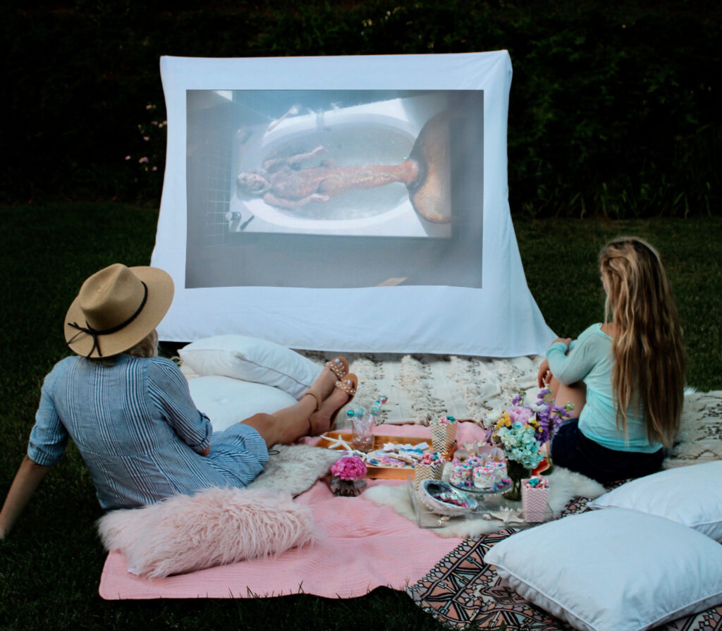 Movie playing at the outdoor mermaid movie party