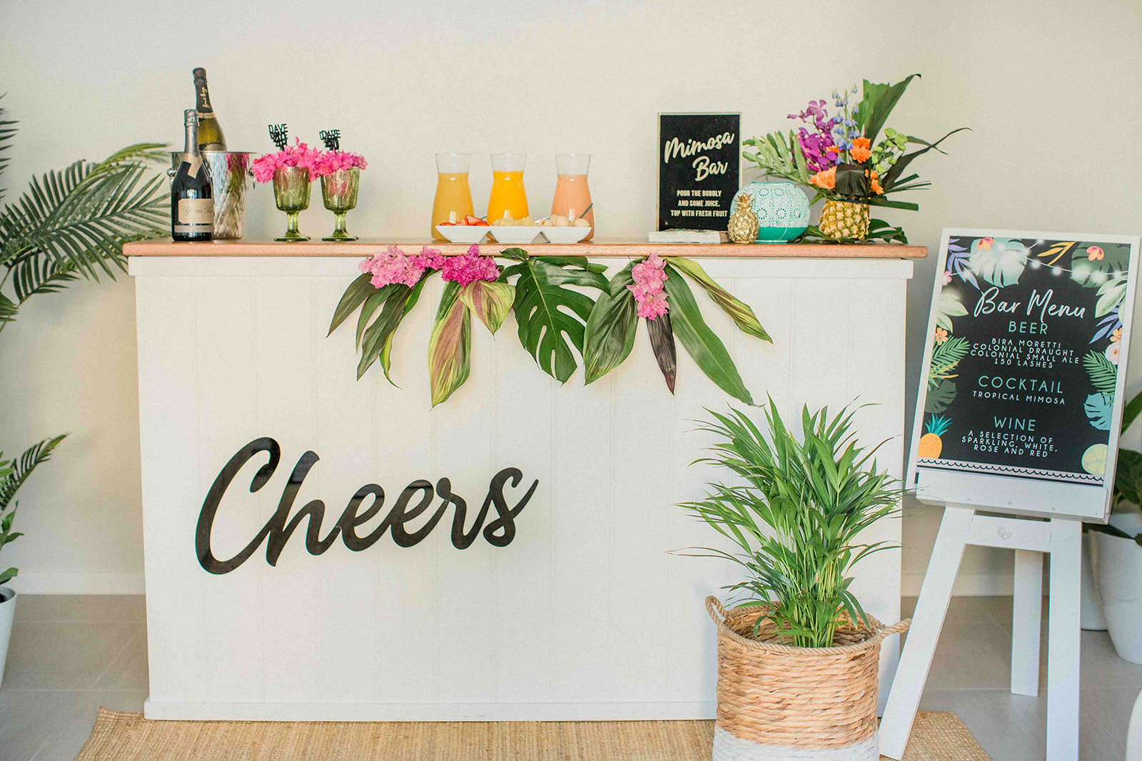 Mimosa bar at the tropical luxe 40th milestone party